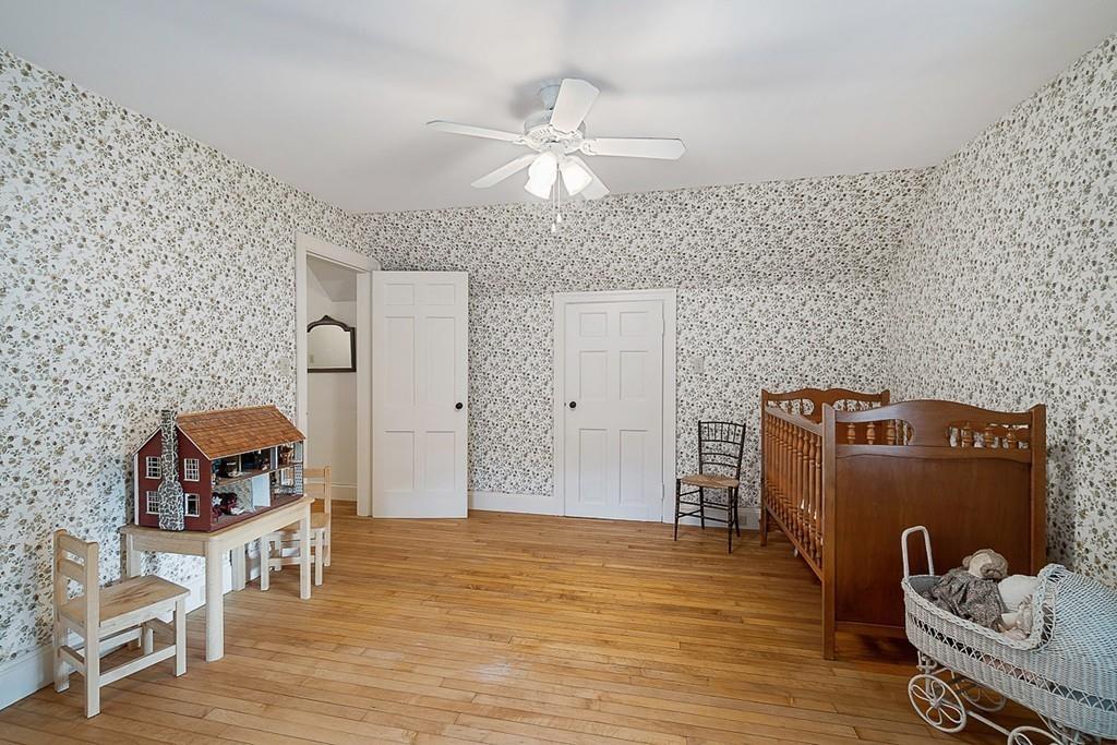 79 Pleasant Street Manchester, MA 01944 - Photo 18 of 28 a living room with furniture and a wooden floor