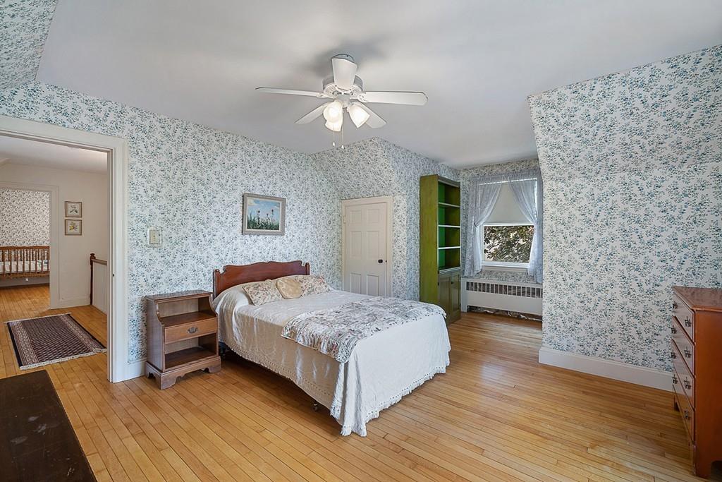 79 Pleasant Street Manchester, MA 01944 - Photo 21 of 28 a bedroom with a bed and a view of bathroom