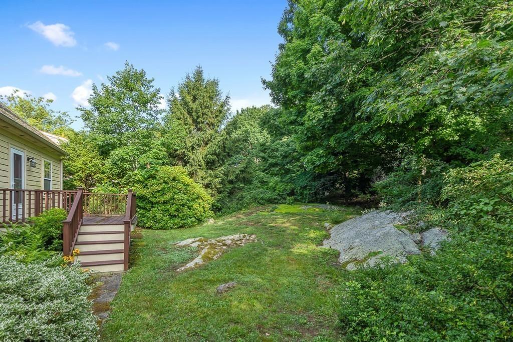 79 Pleasant Street Manchester, MA 01944 - Photo 25 of 28 a view of a house with a yard