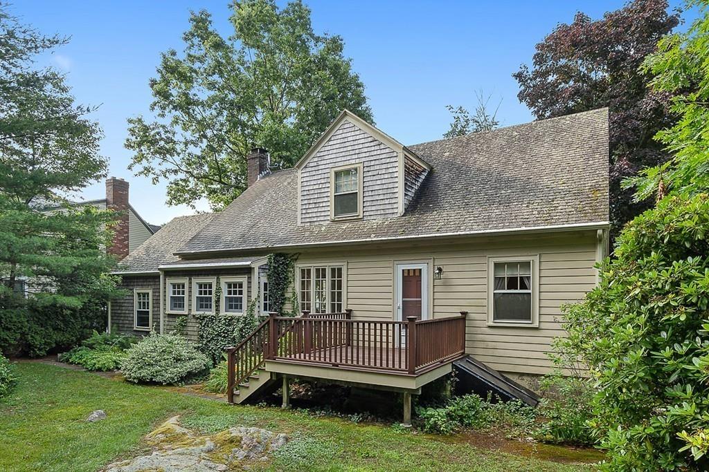 79 Pleasant Street Manchester, MA 01944 - Photo 27 of 28 a front view of a house with a garden