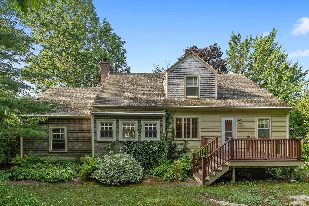 79 Pleasant Street Manchester, MA 01944 - Photo 28 of 28 a front view of a house with a garden