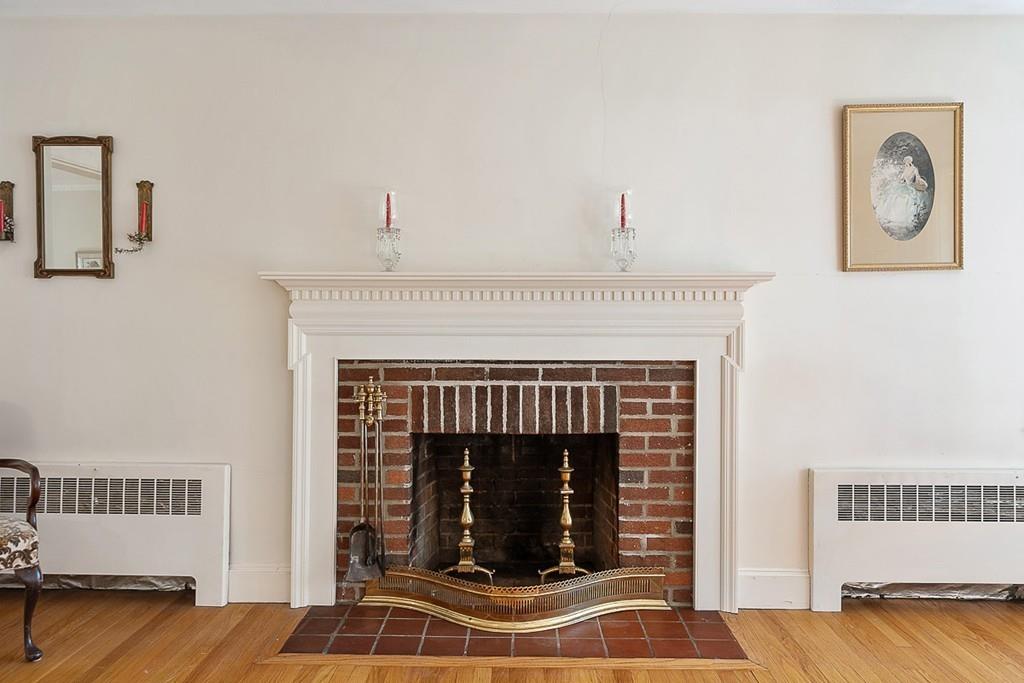 79 Pleasant Street Manchester, MA 01944 - Photo 6 of 28 a living room with a couch and a fireplace