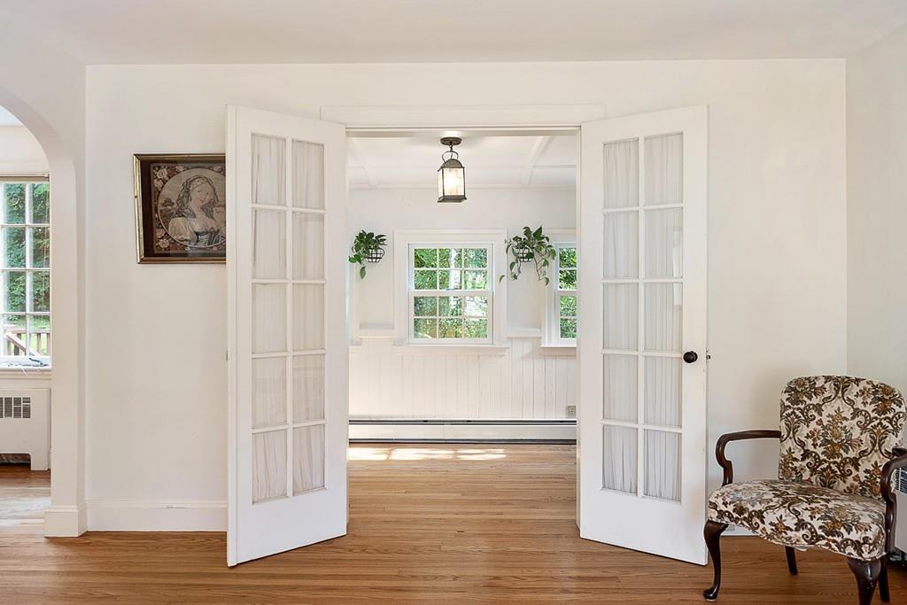 79 Pleasant Street Manchester, MA 01944 - Photo 7 of 28 a view of livingroom with hardwood floor and hallway