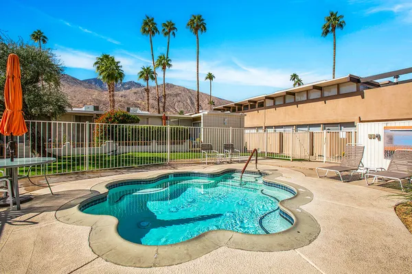 a kitchen with stainless steel appliances kitchen island granite countertop a refrigerator and a stove top oven