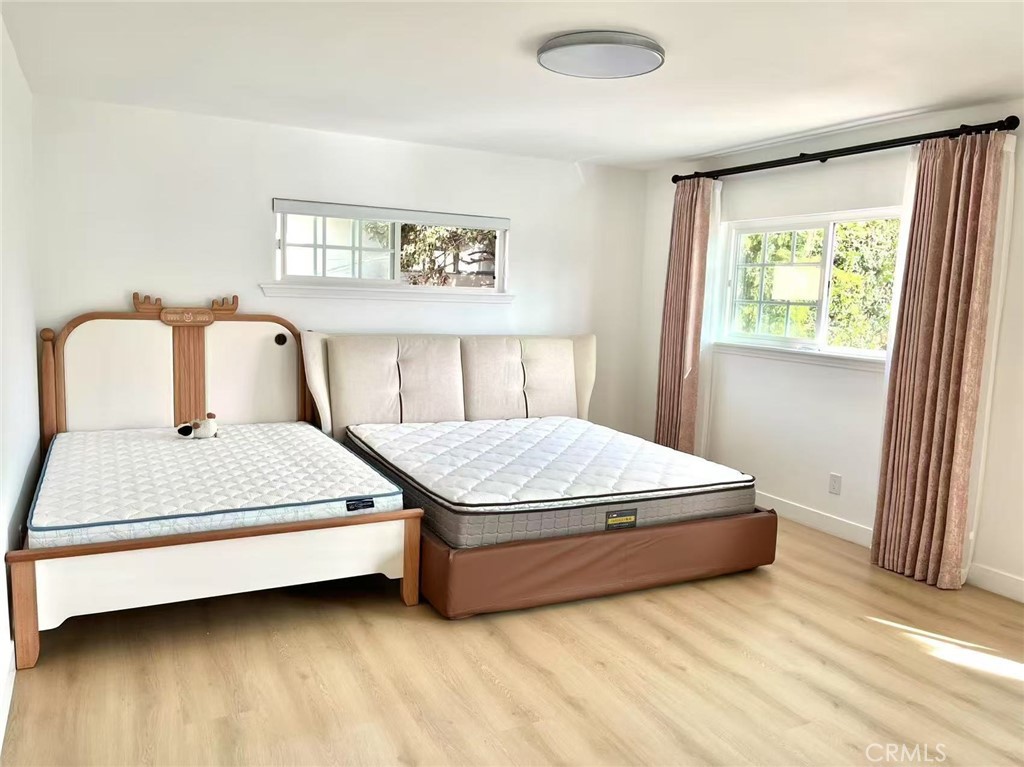 1500 Loganrita Avenue Arcadia, CA 91006 - Photo 13 of 29 a bedroom with a bed lamp and window