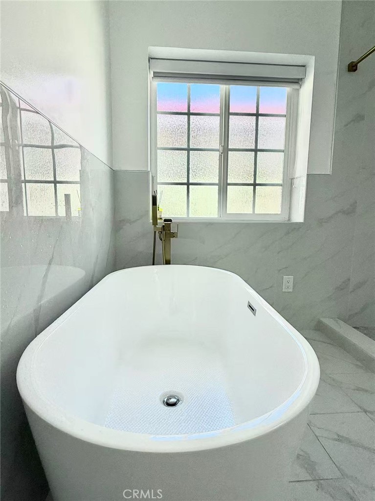 1500 Loganrita Avenue Arcadia, CA 91006 - Photo 16 of 29 a white bath tub sitting in a bathroom next to a window