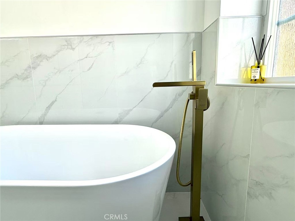 1500 Loganrita Avenue Arcadia, CA 91006 - Photo 17 of 29 a white bath tub sitting in a bathroom