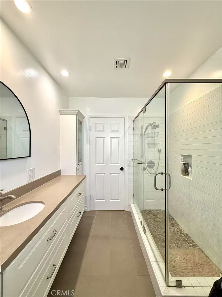 1500 Loganrita Avenue Arcadia, CA 91006 - Photo 23 of 29 a bathroom with a granite countertop sink mirror bathtub and shower