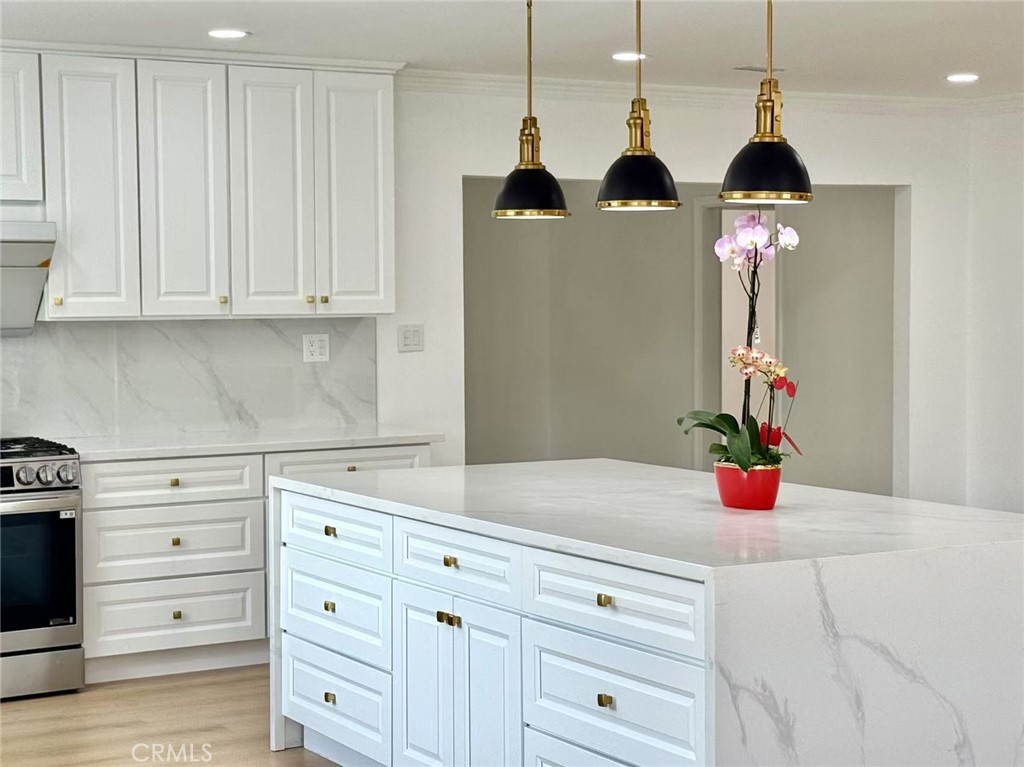 1500 Loganrita Avenue Arcadia, CA 91006 - Photo 7 of 29 a kitchen with a stove and cabinets