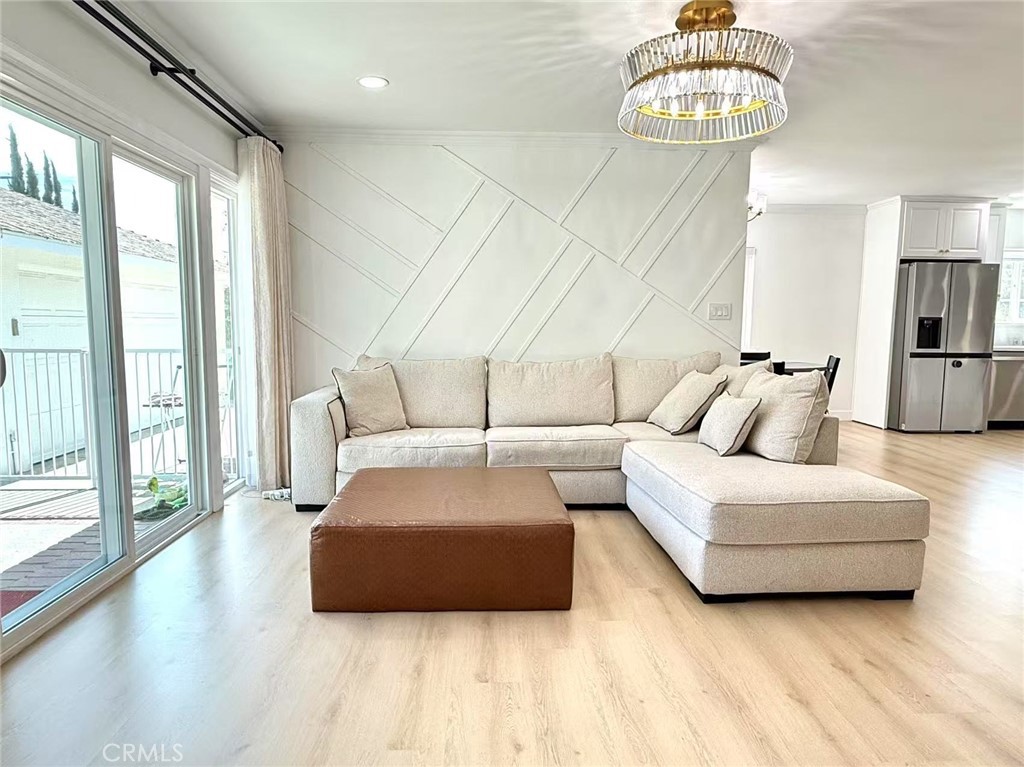 1500 Loganrita Avenue Arcadia, CA 91006 - Photo 10 of 29 a living room with furniture and a chandelier