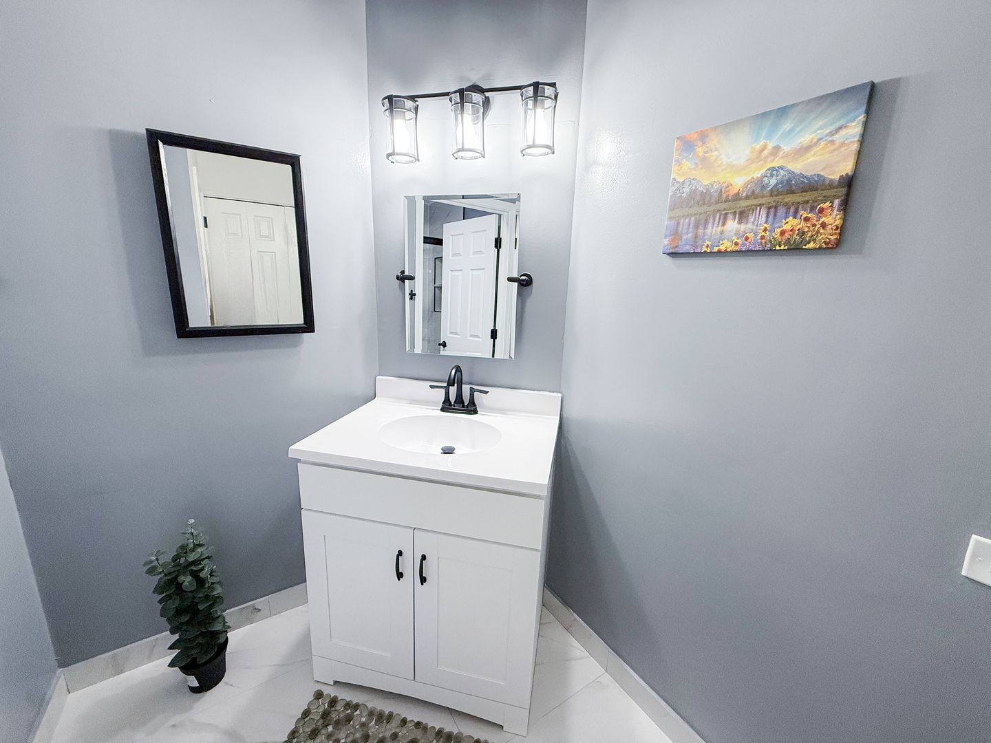 151 Brookston Drive, Unit A2 Schaumburg, IL 60193 - Photo 11 of 18 a bathroom with a sink and mirror