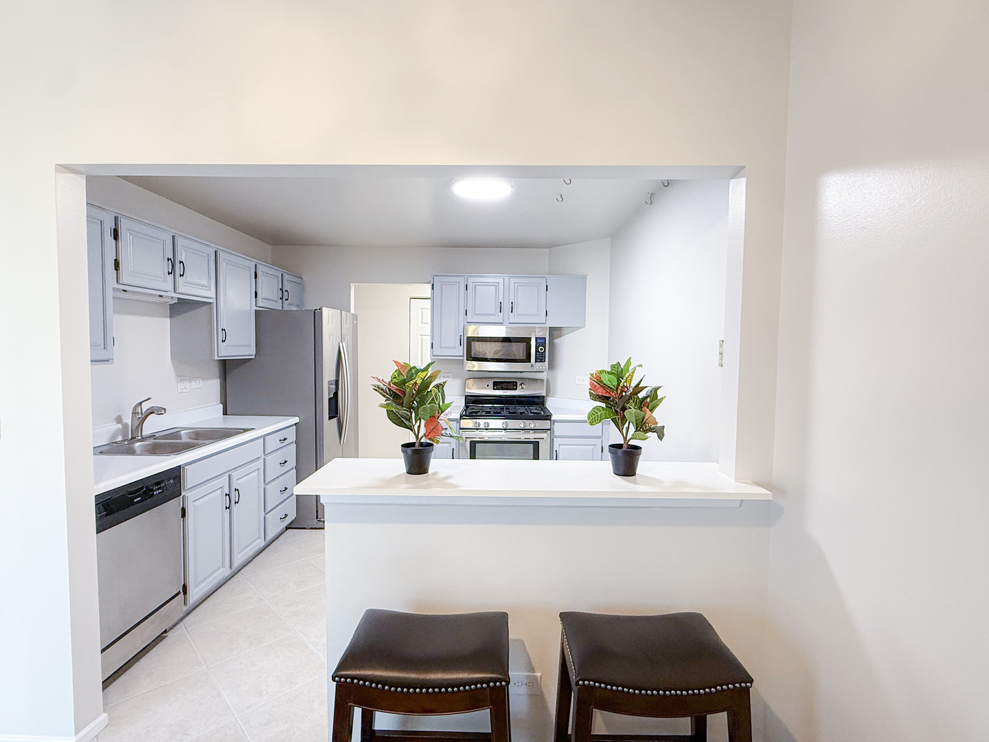 151 Brookston Drive, Unit A2 Schaumburg, IL 60193 - Photo 5 of 18 a kitchen with a sink cabinets and counter top space