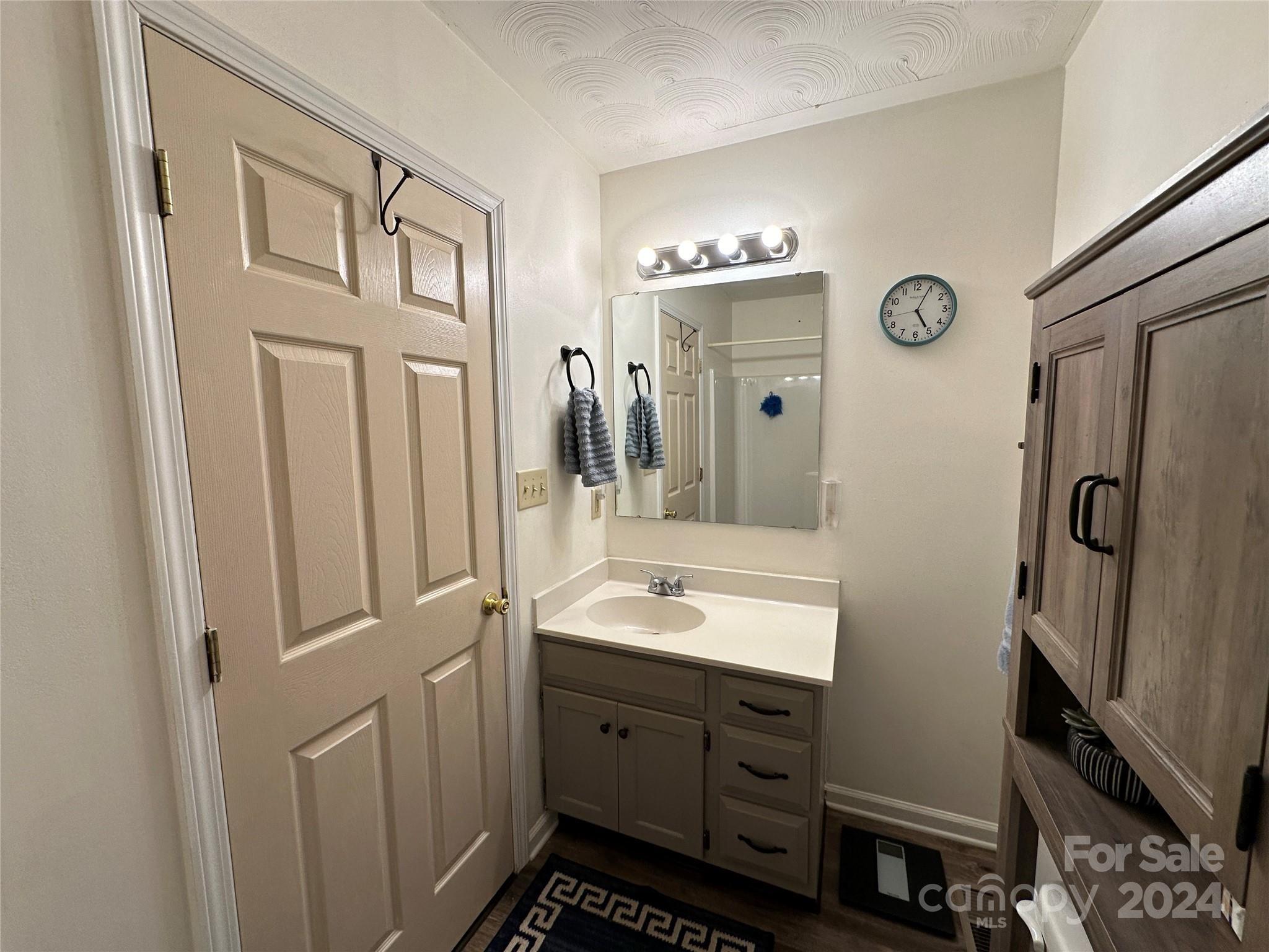 4886 Sandstone Drive Conover, NC 28613 - Photo 18 of 22 a spacious bathroom with a double vanity sink and a mirror