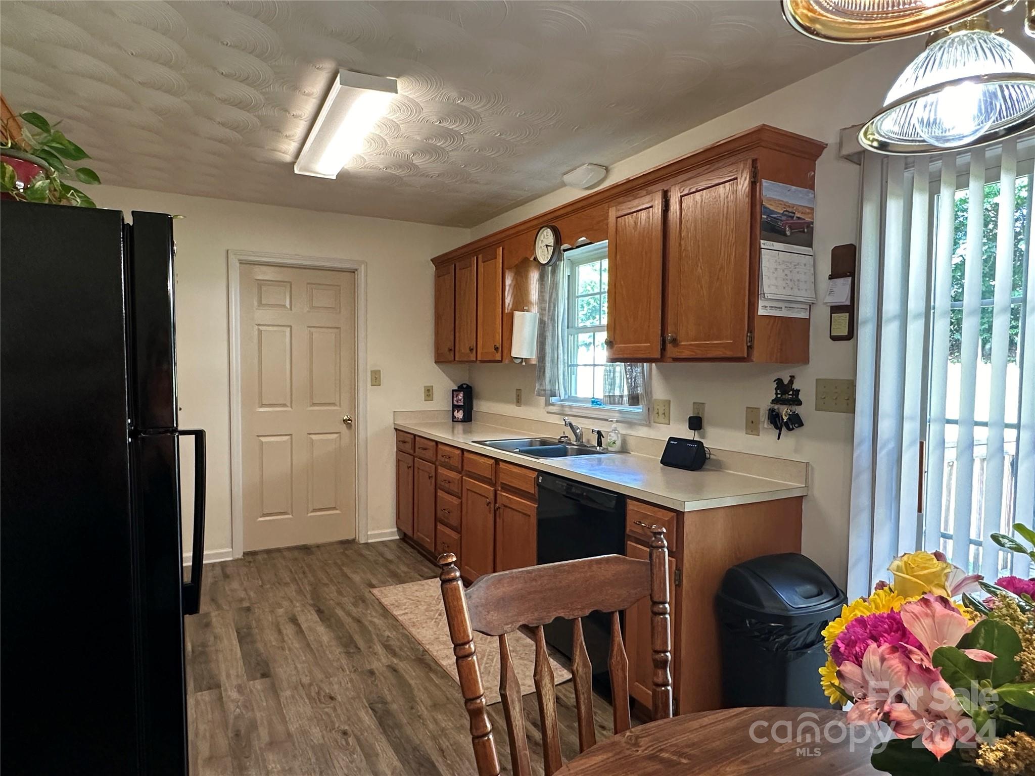 4886 Sandstone Drive Conover, NC 28613 - Photo 2 of 22 a kitchen with a sink stove and refrigerator