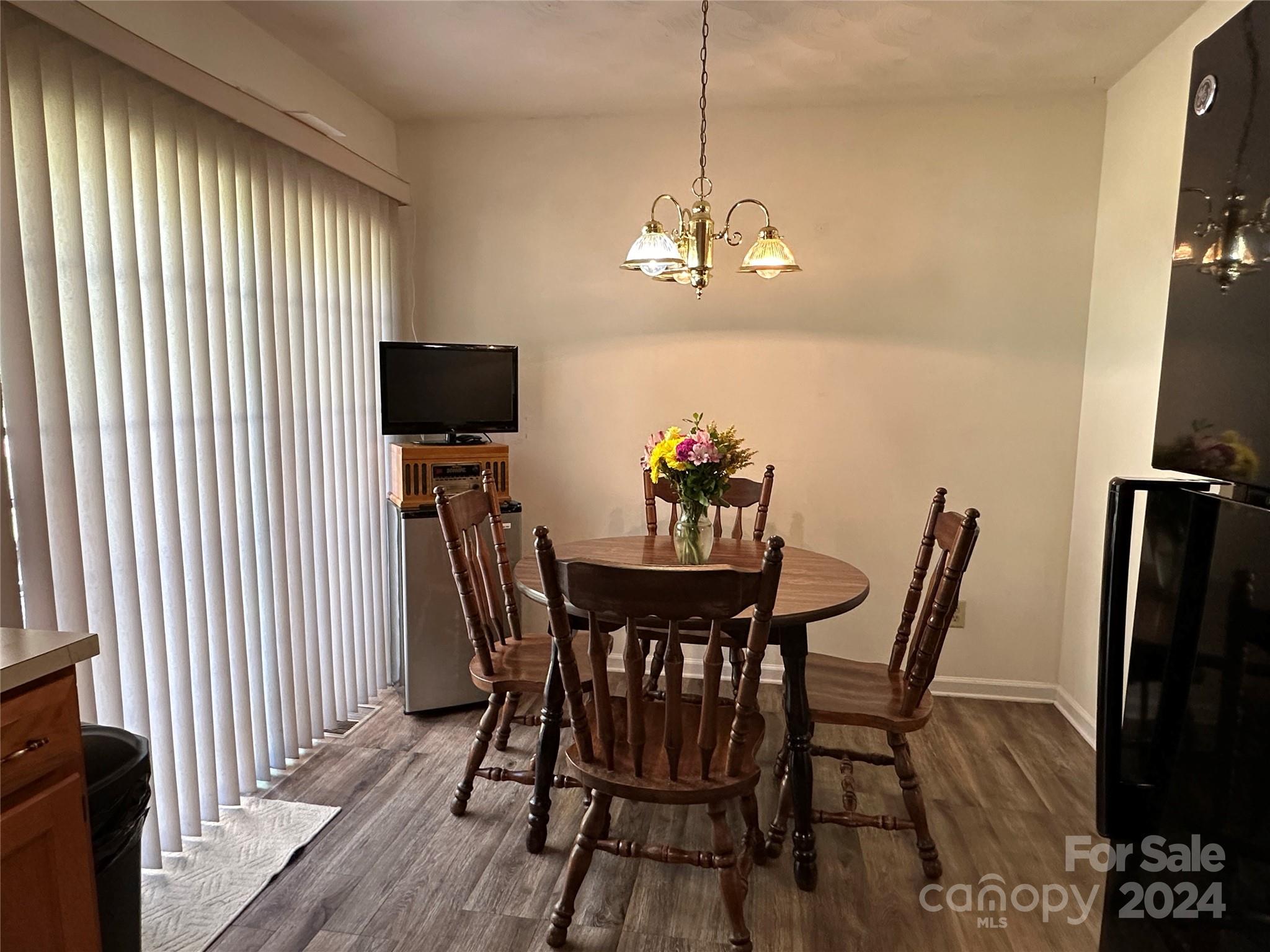 4886 Sandstone Drive Conover, NC 28613 - Photo 4 of 22 a view of a dining room with furniture window and wooden floor