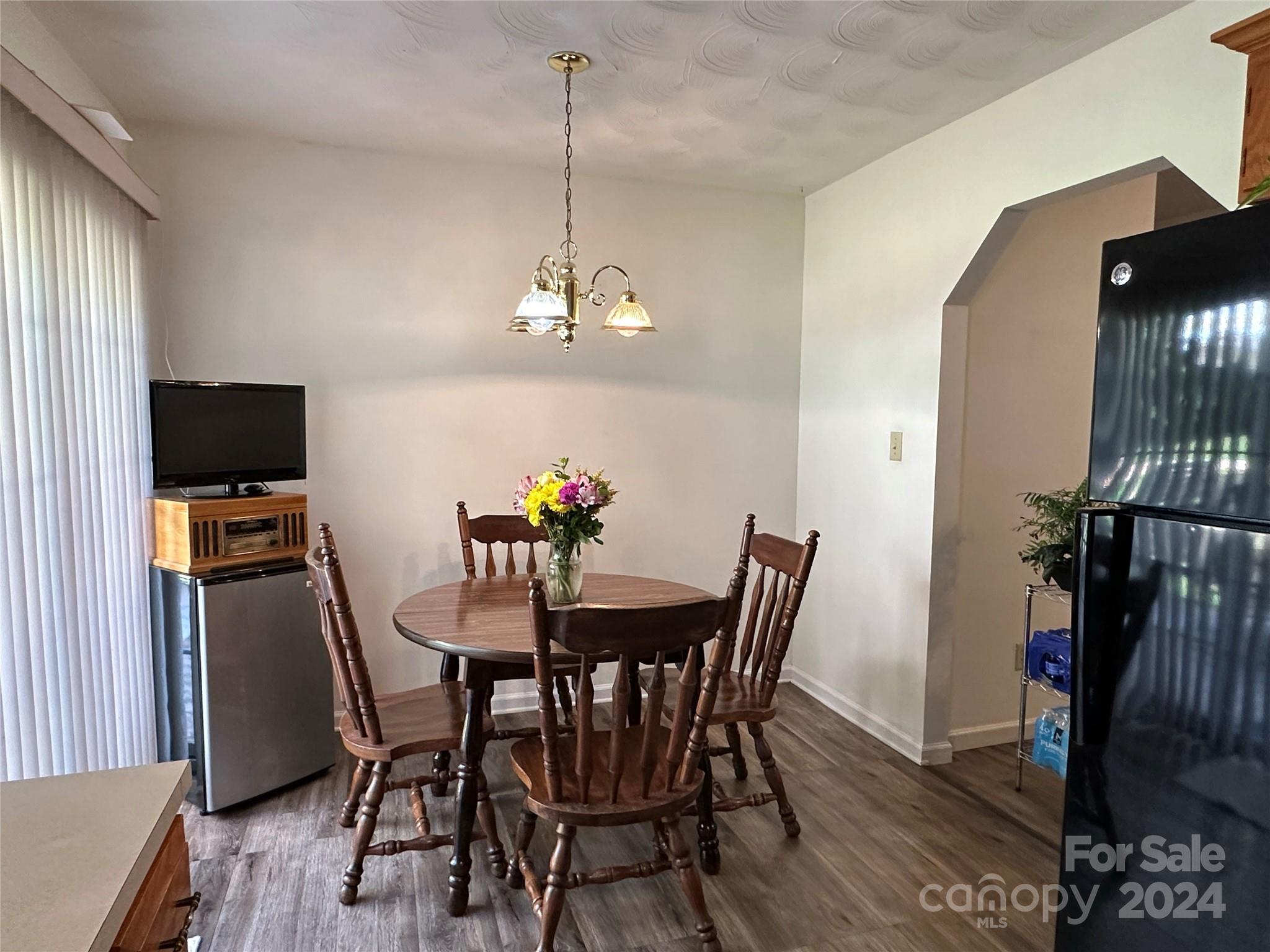 4886 Sandstone Drive Conover, NC 28613 - Photo 5 of 22 a view of a dining room with furniture and chandelier