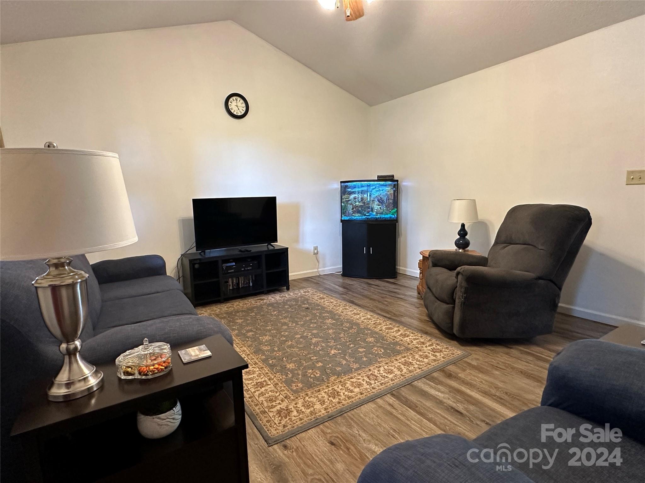 4886 Sandstone Drive Conover, NC 28613 - Photo 6 of 22 a living room with furniture and a flat screen tv
