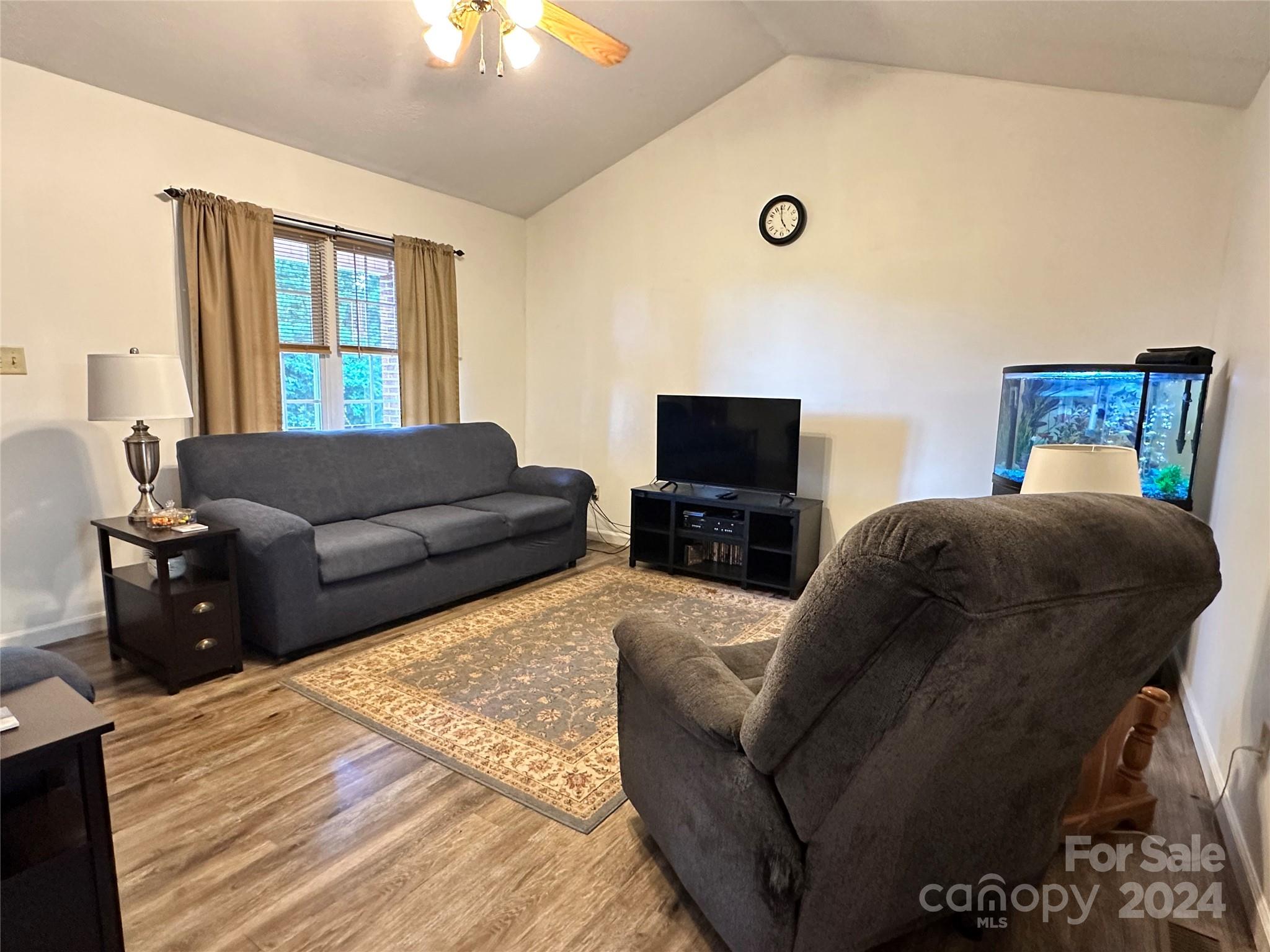 4886 Sandstone Drive Conover, NC 28613 - Photo 7 of 22 a living room with furniture and a flat screen tv