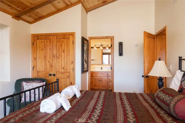 a bedroom with furniture and a wooden floor