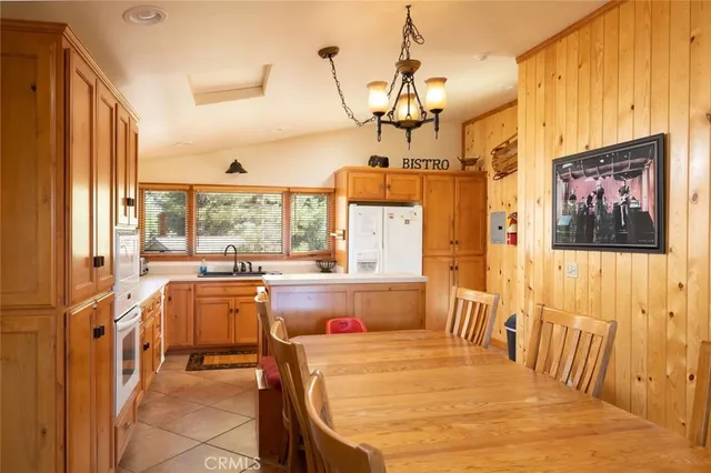 a very nice looking dining room with a large window