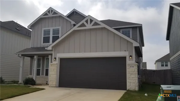 a front view of a house with garage