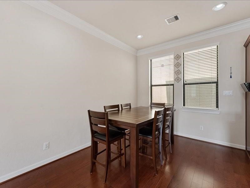 5502 Lunia Lane Houston, TX 77021 - Photo 12 of 15 a view of a dining room with furniture and wooden floor