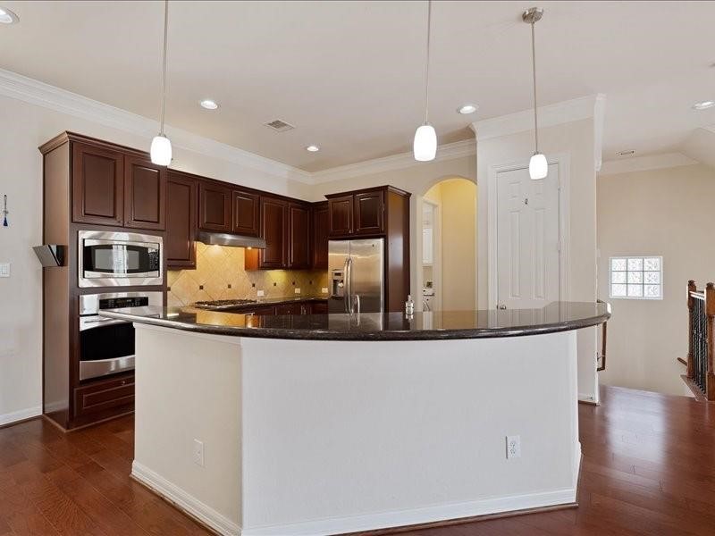 5502 Lunia Lane Houston, TX 77021 - Photo 13 of 15 a kitchen with stainless steel appliances granite countertop a sink a stove and refrigerator