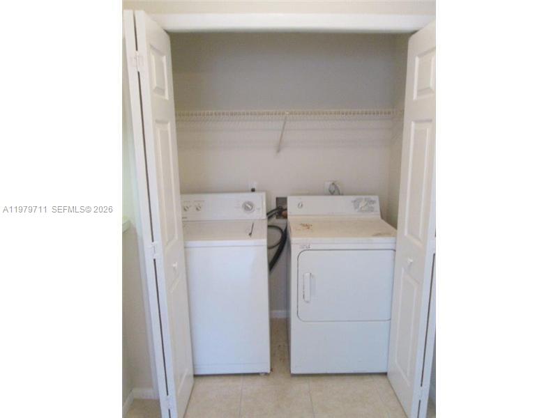 4241 West McNab Road, Unit 30 Pompano Beach, FL 33069 - Photo 28 of 35 a utility room with dryer and washer
