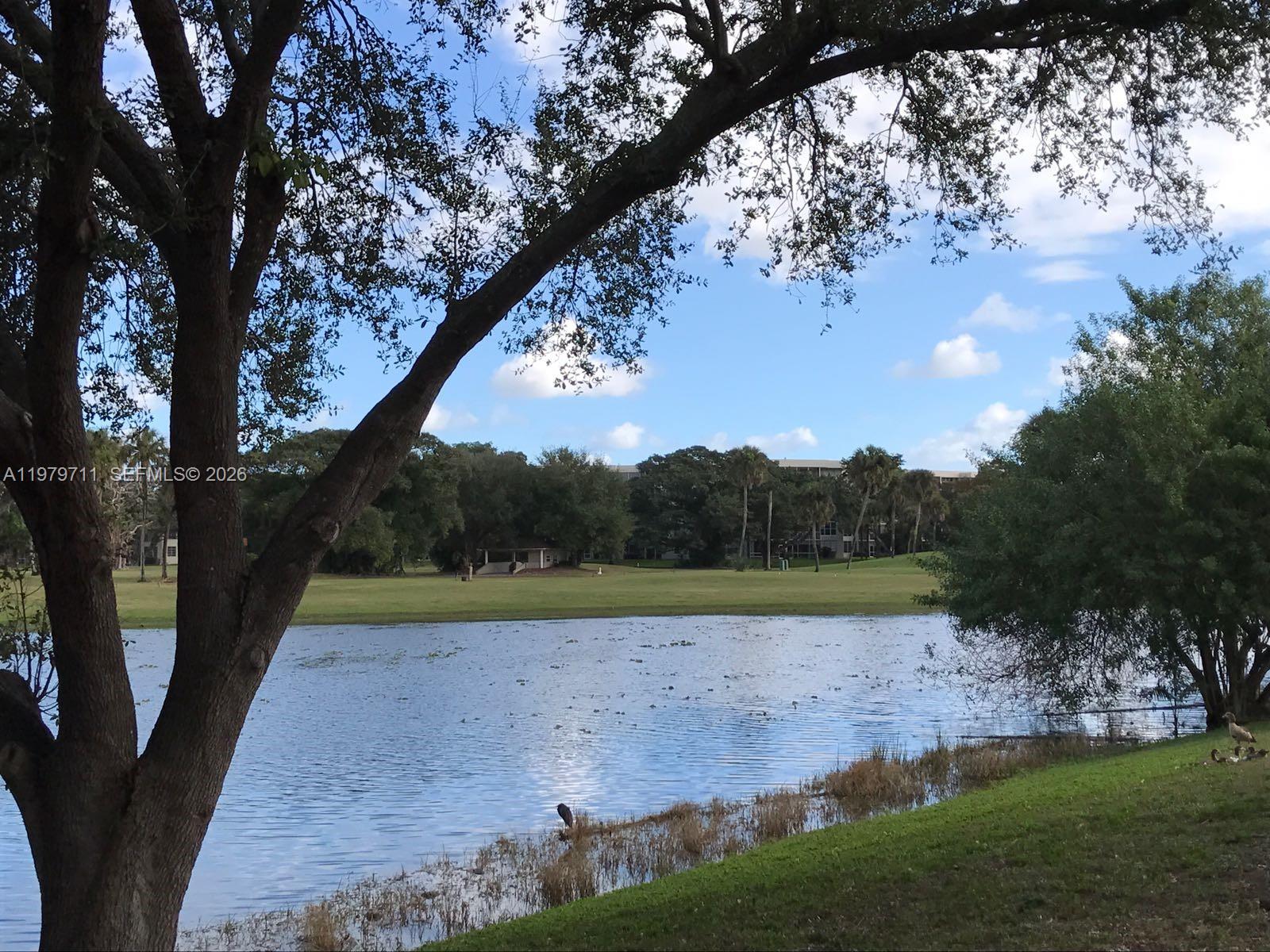 4241 West McNab Road, Unit 30 Pompano Beach, FL 33069 - Photo 34 of 35 a view of an outdoor space with a lake view