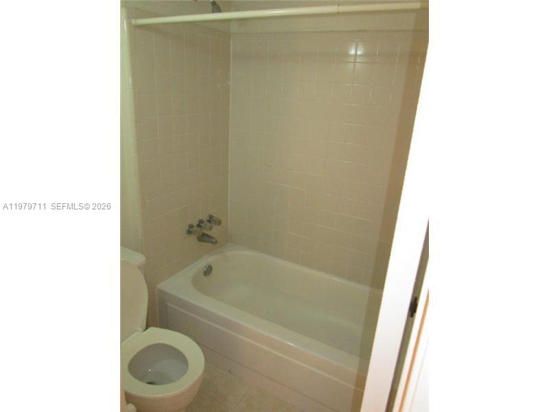 4241 West McNab Road, Unit 30 Pompano Beach, FL 33069 - Photo 7 of 35 a bathroom with a bathtub and toilet