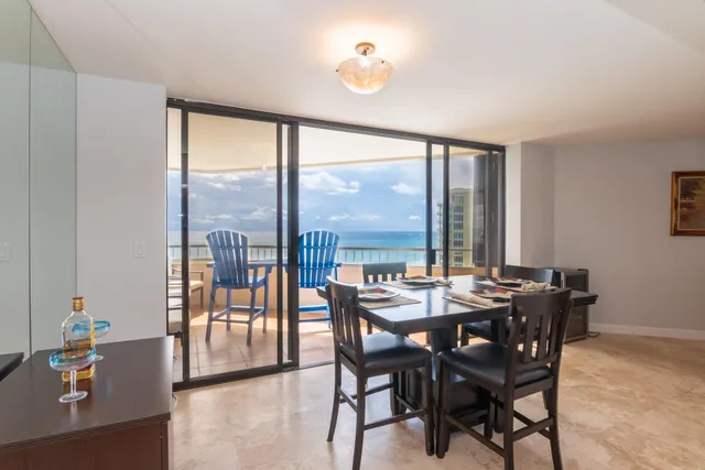 a view of a dining room with furniture window and outside view