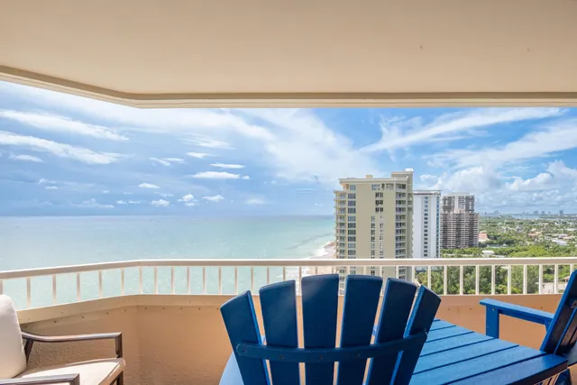 a view of balcony with furniture