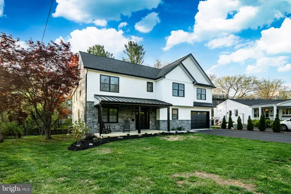 a view of house with yard and entertaining space