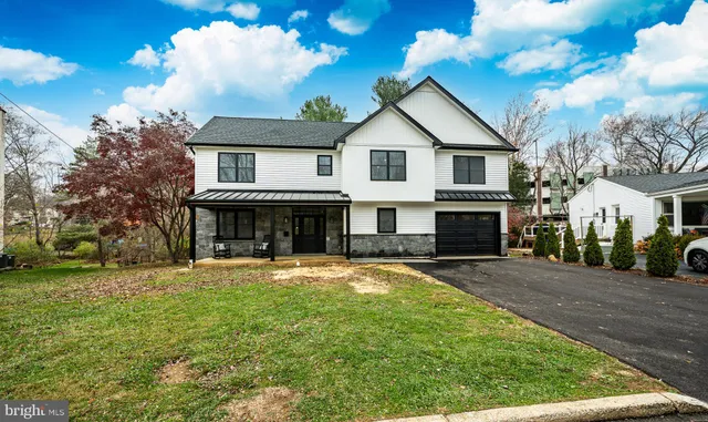 a view of house with outdoor space and sitting area