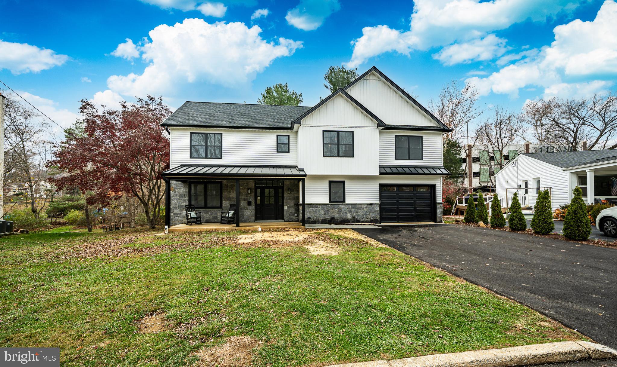 a view of house with outdoor space and sitting area