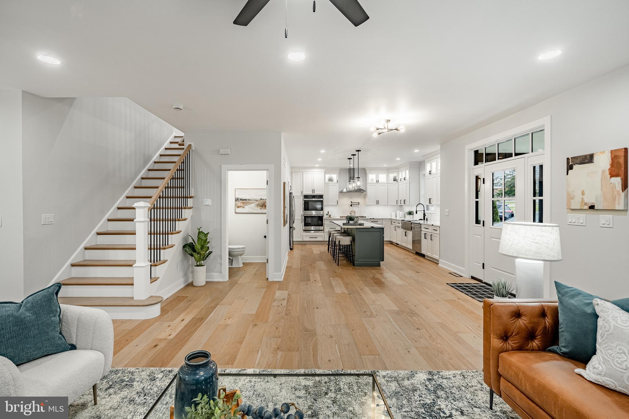 714 South Wayne Street West Chester, PA 19382 - Photo 11 of 62 a living room with furniture and kitchen view with wooden floor
