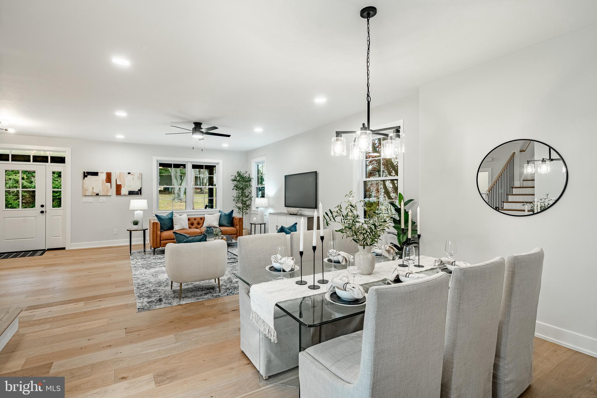 714 South Wayne Street West Chester, PA 19382 - Photo 14 of 62 a living room with furniture a mirror and a flat screen tv