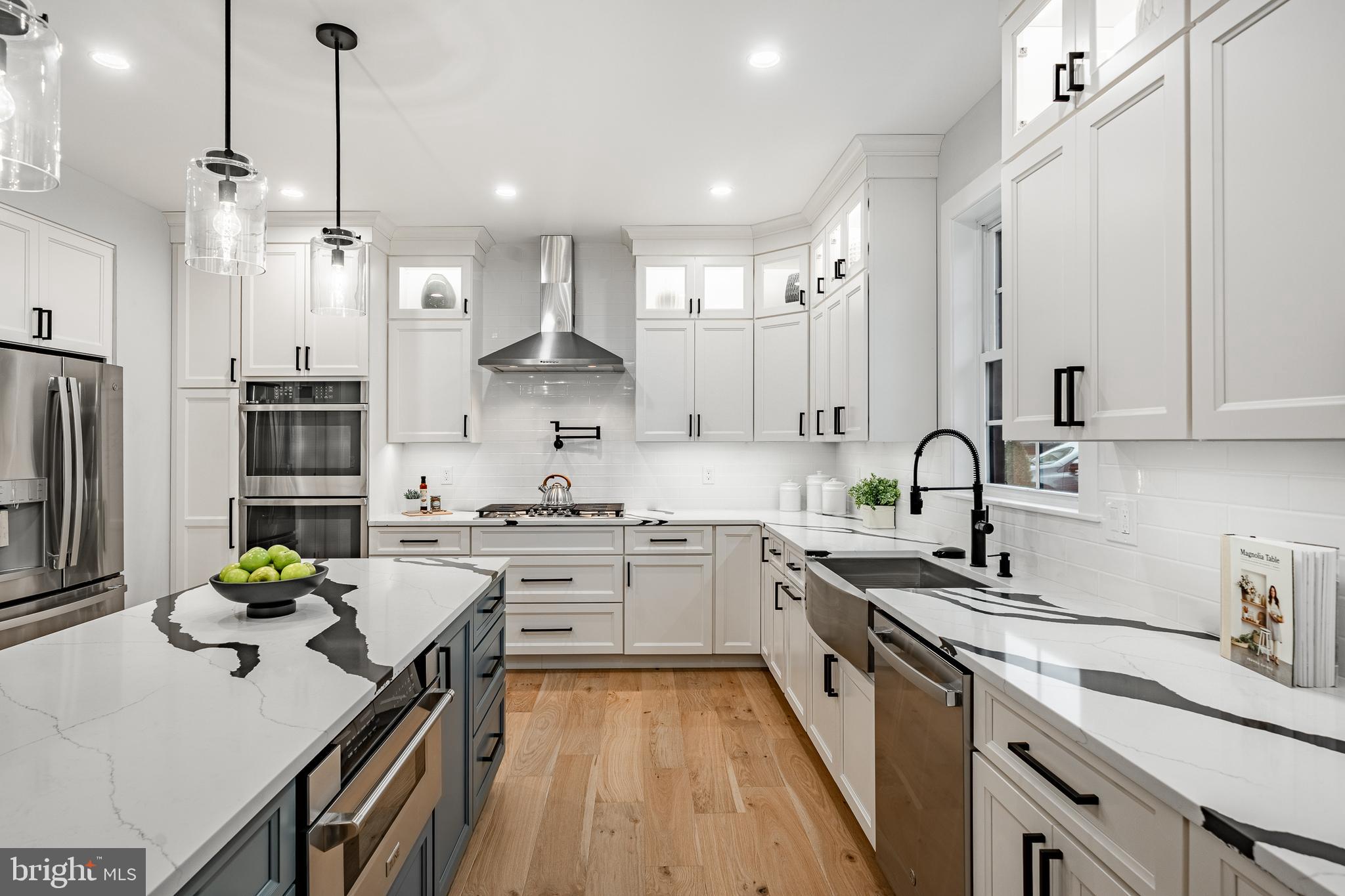 714 South Wayne Street West Chester, PA 19382 - Photo 16 of 62 a kitchen with stainless steel appliances granite countertop sink stove top oven and refrigerator