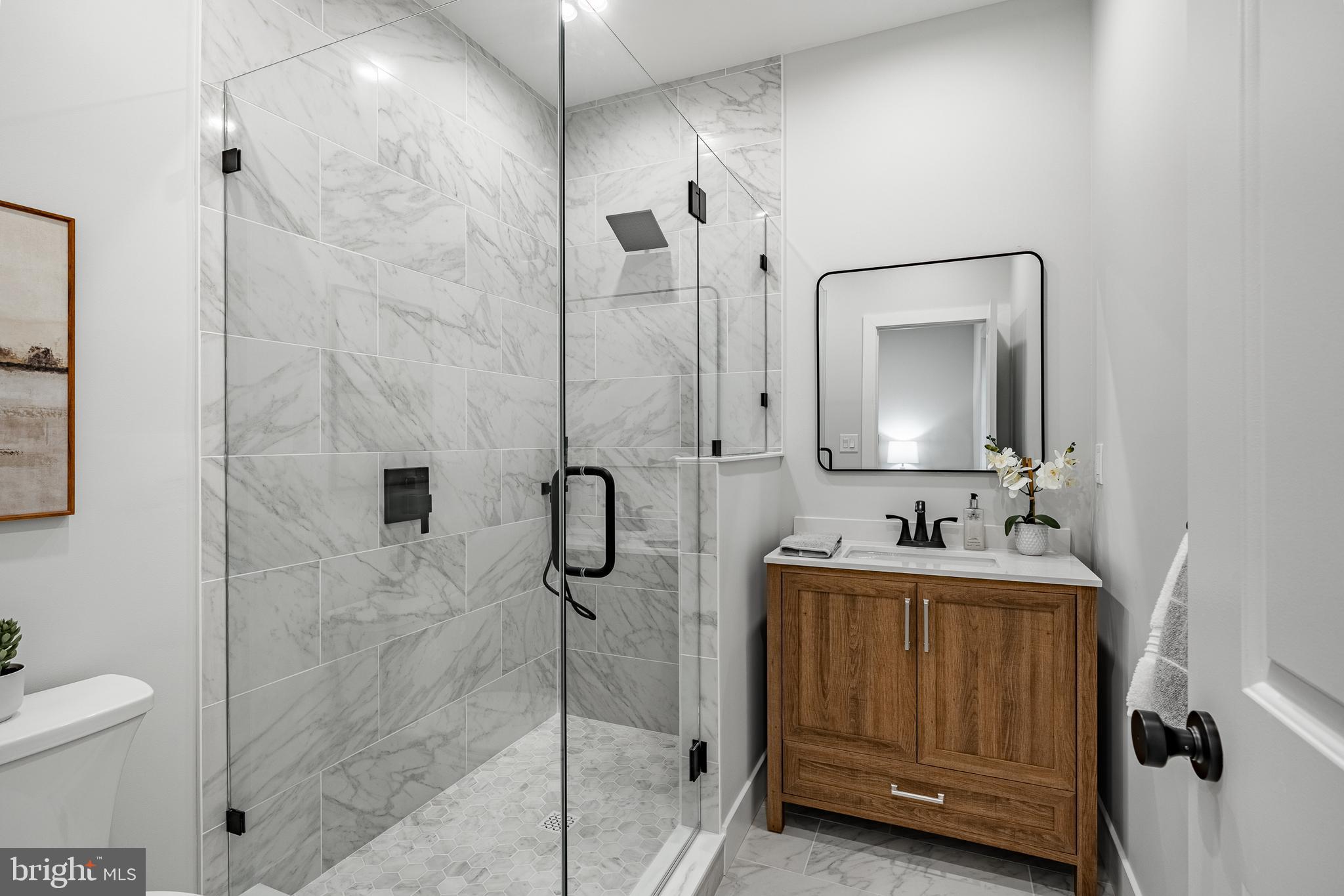 714 South Wayne Street West Chester, PA 19382 - Photo 25 of 62 a bathroom with a toilet sink and mirror