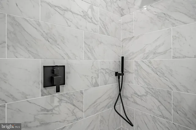 a utility room with cabinets washer and dryer