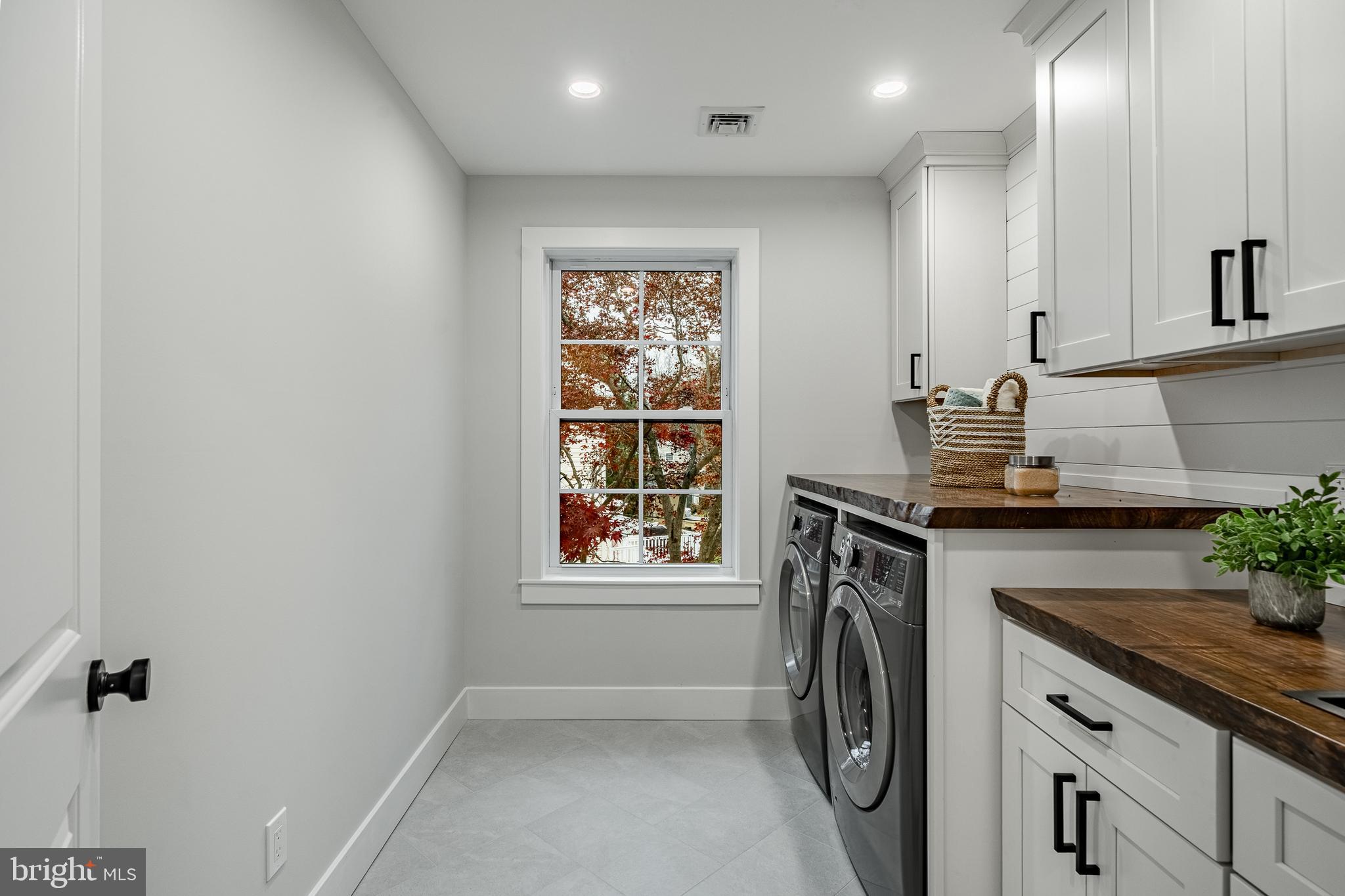 714 South Wayne Street West Chester, PA 19382 - Photo 31 of 62 a utility room with cabinets washer and dryer