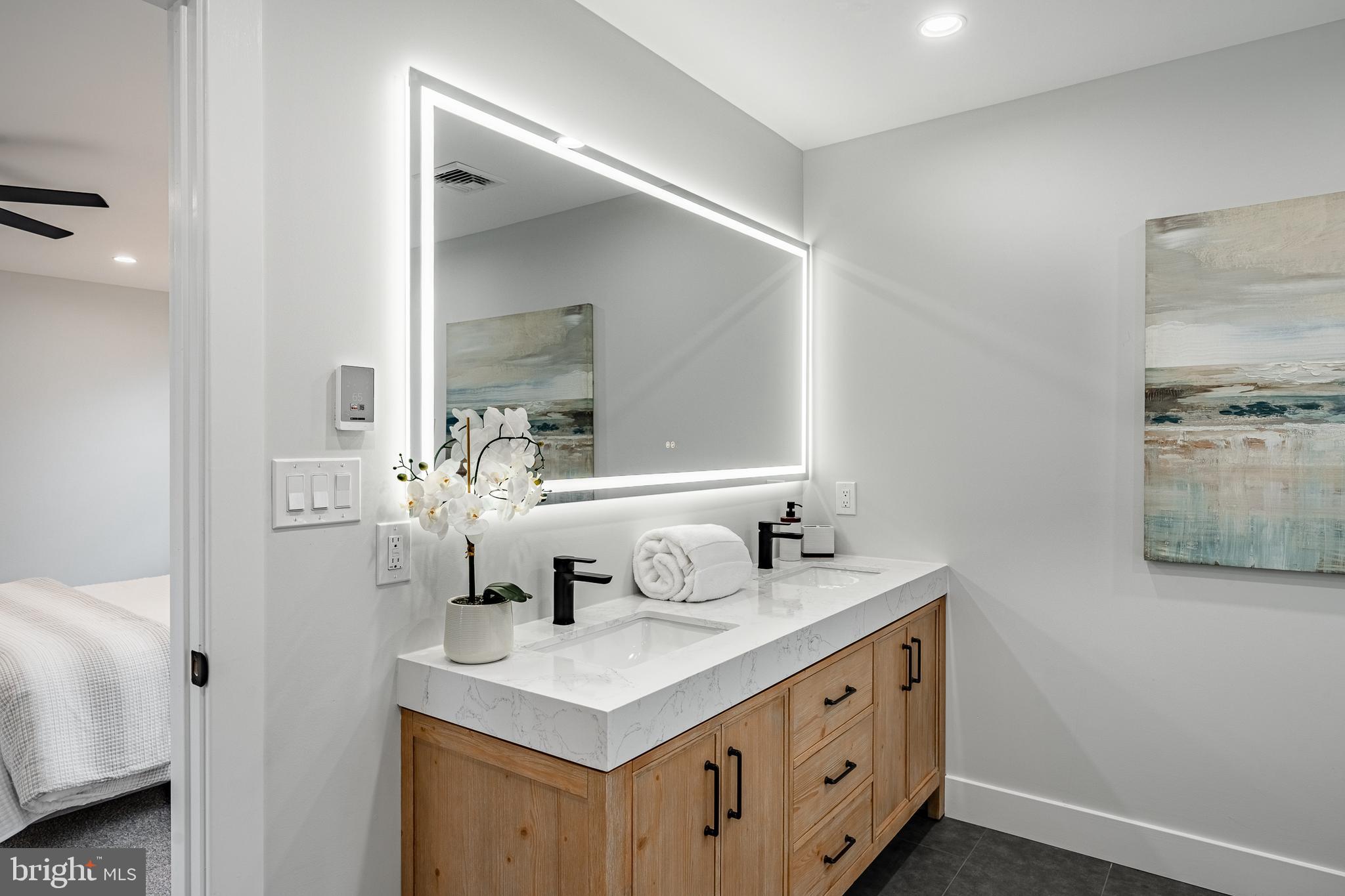 714 South Wayne Street West Chester, PA 19382 - Photo 37 of 62 a bathroom with a sink and a mirror