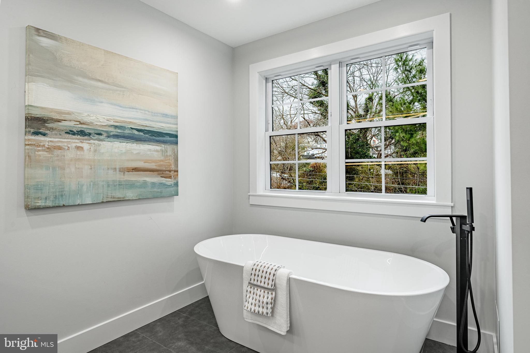714 South Wayne Street West Chester, PA 19382 - Photo 40 of 62 a white bath tub sitting in a bathroom next to a window