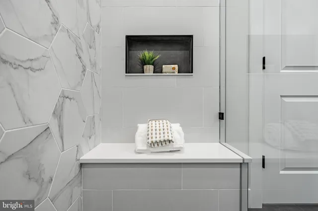 a bathroom with a sink vanity and a mirror