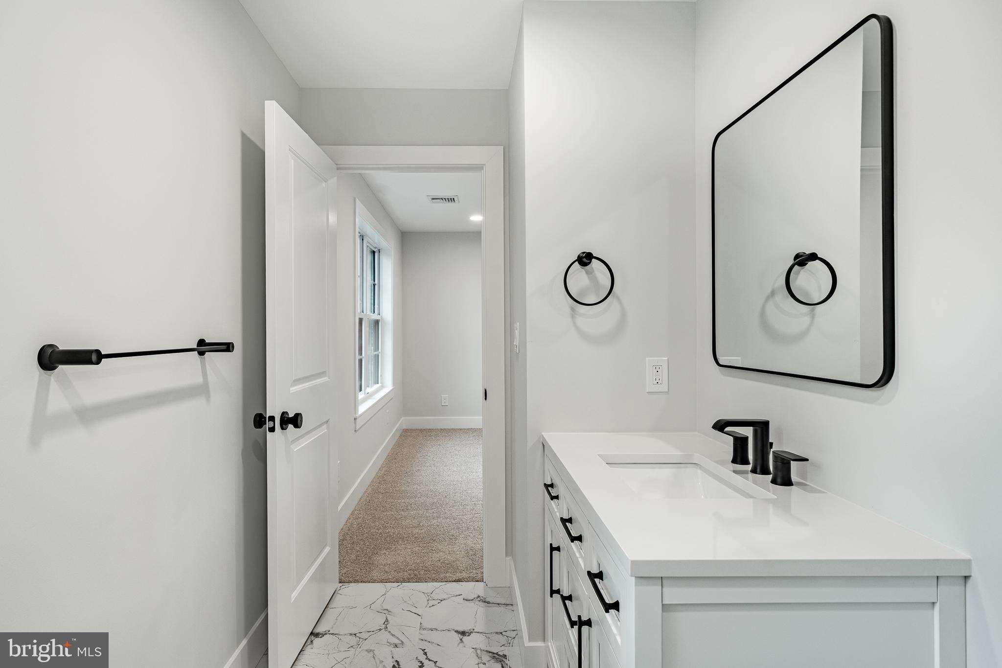 714 South Wayne Street West Chester, PA 19382 - Photo 45 of 62 a bathroom with a sink and a mirror