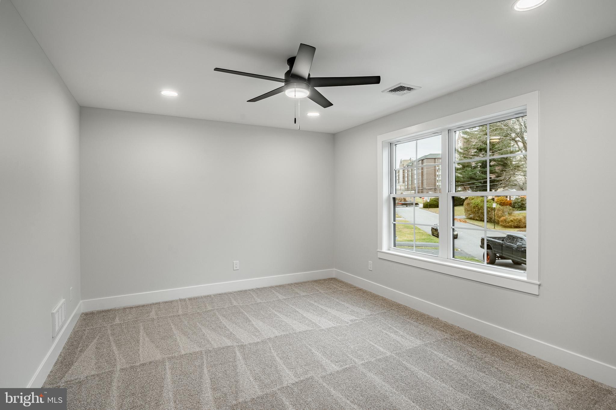 714 South Wayne Street West Chester, PA 19382 - Photo 49 of 62 an empty room with windows and ceiling fan