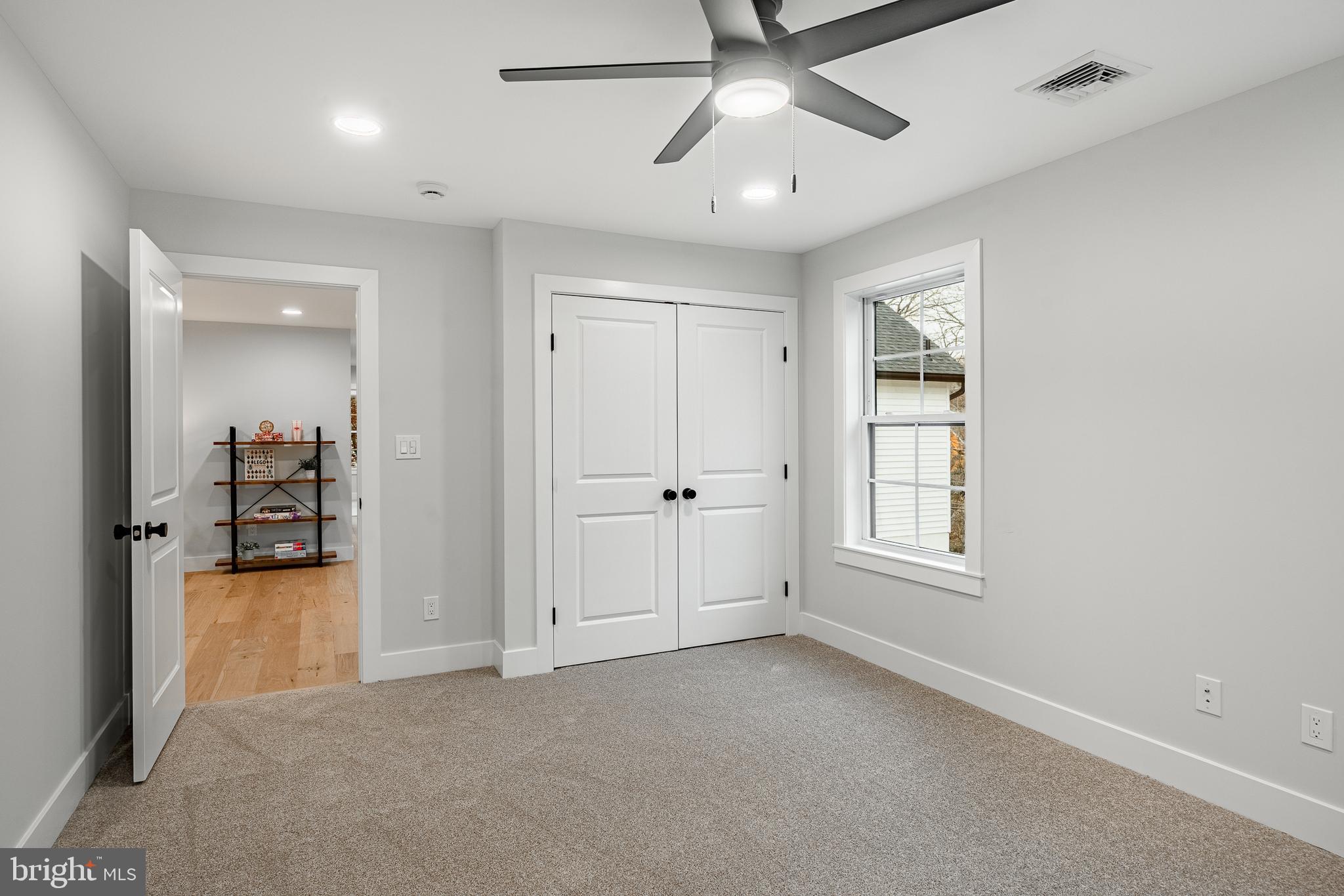 714 South Wayne Street West Chester, PA 19382 - Photo 51 of 62 an empty room with chandelier fan and windows
