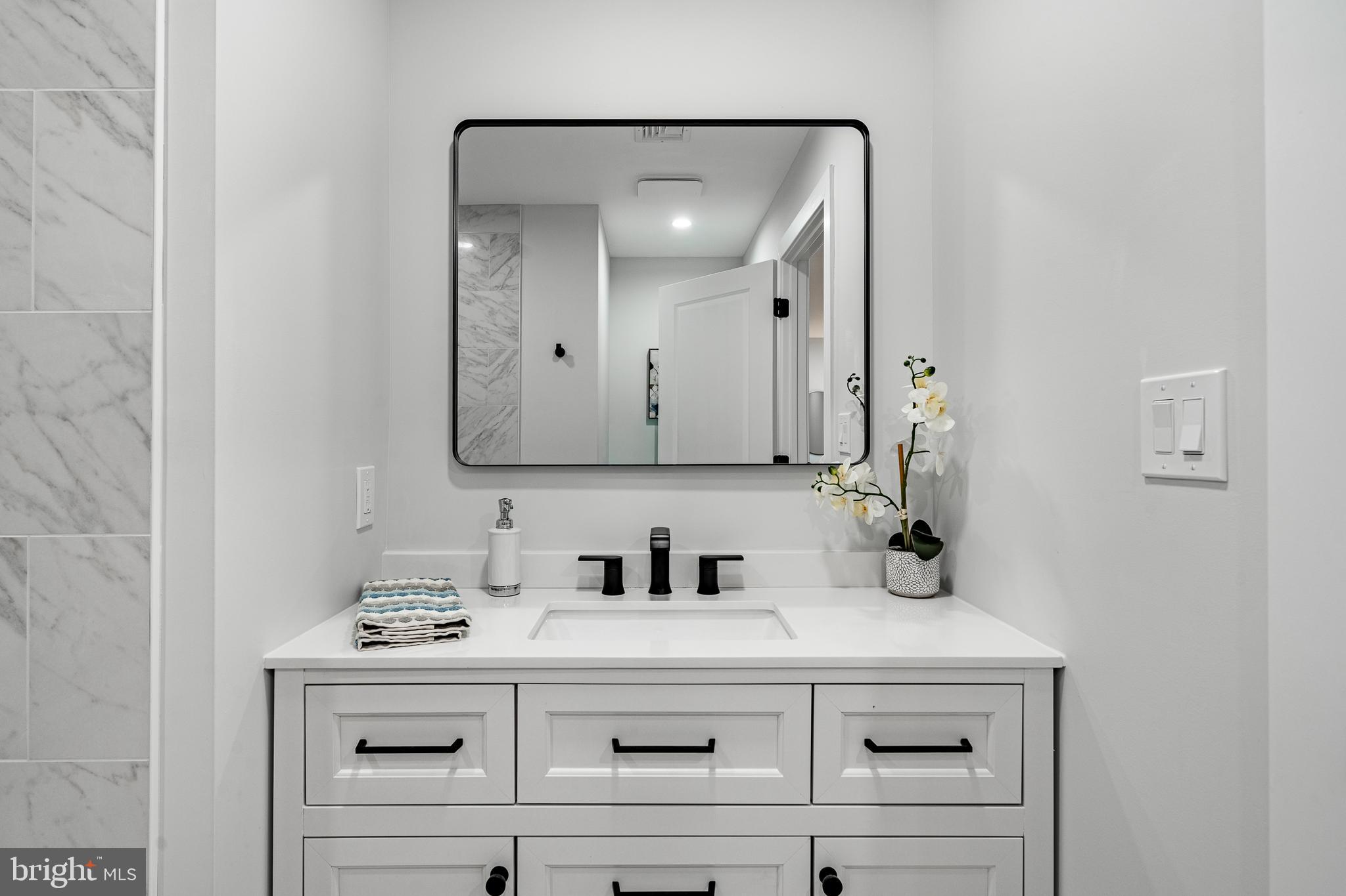 714 South Wayne Street West Chester, PA 19382 - Photo 52 of 62 a bathroom with a sink vanity and a mirror