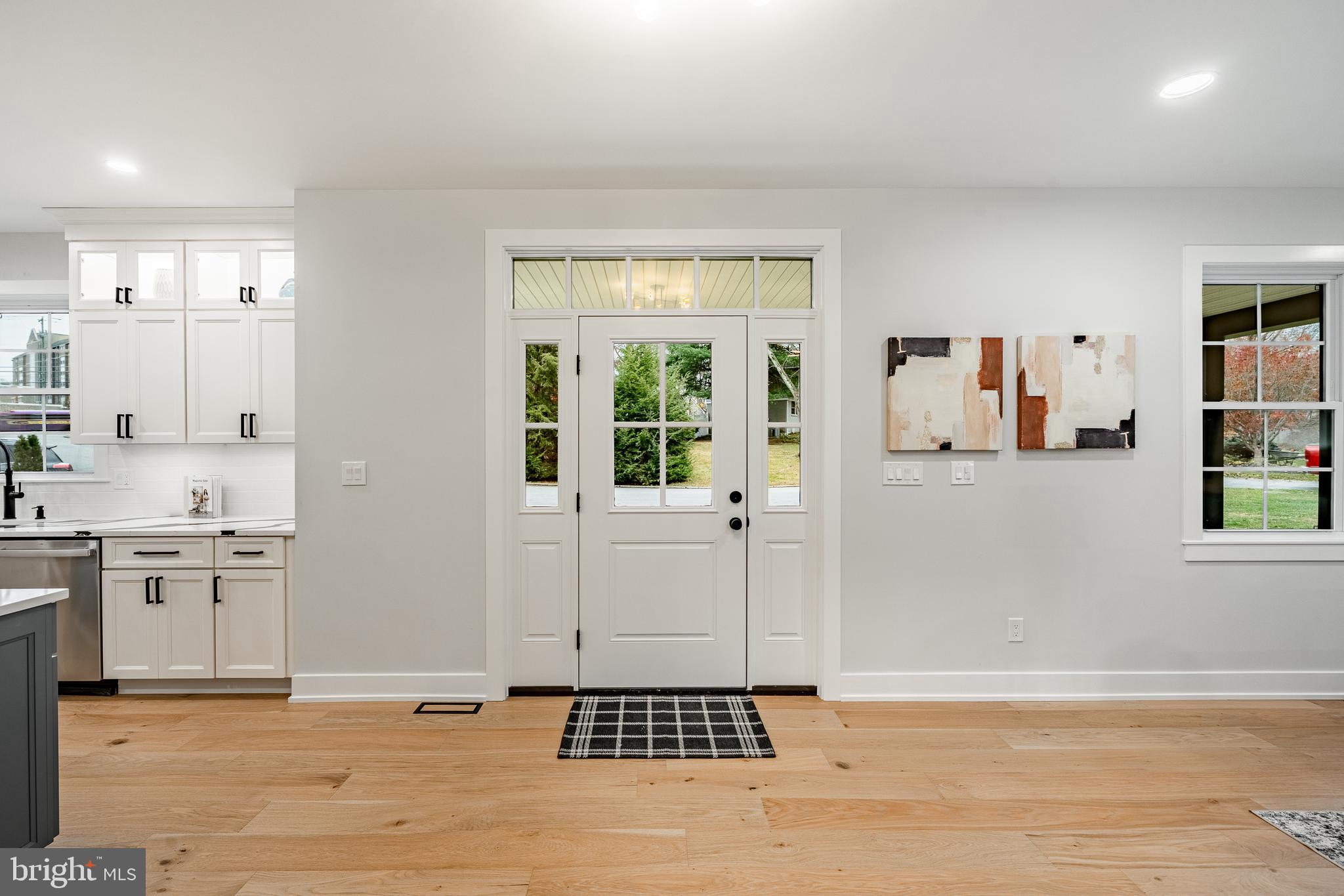 714 South Wayne Street West Chester, PA 19382 - Photo 6 of 62 a view of a kitchen with a sink cabinets and wooden floor
