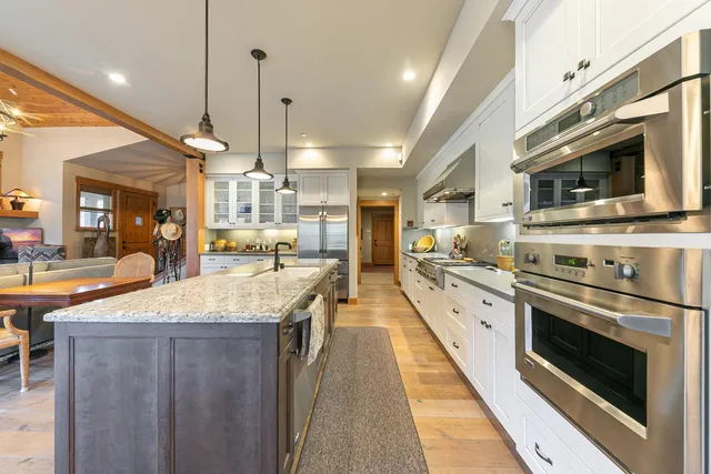 a large kitchen with stainless steel appliances granite countertop lots of counter top space